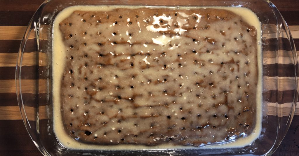 cake with holes and yogurt mixture for Dairy Free Better Than Anything Cake